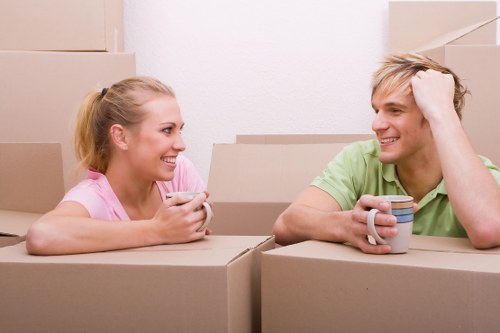 Professional movers carrying furniture near local Fulwell homes