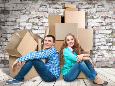 Office furniture and boxes organised for commercial removals