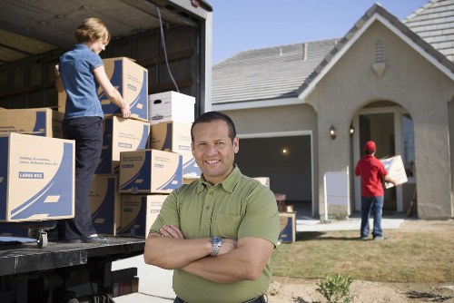 Loading items into a moving van for a Fulwell relocation