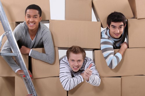 Packed boxes and furniture ready for removal in a Fulwell property