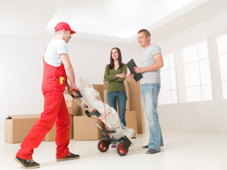 Professional movers handling furniture during a Fulwell house move
