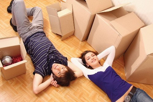 Furniture and boxes being organised in a removals van